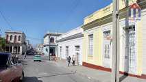 View into the street. At the end the Paseo of Cienfuegos leads along