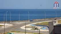 Just a few meters away from the seawall Malecón - your view from shared balcony