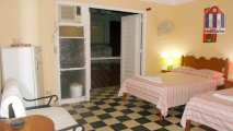 A spacious and comfortable guest room in the Centro Habana district