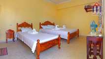 The room is quite spacious and has 2 beds: 1 x double + 1 x single bed